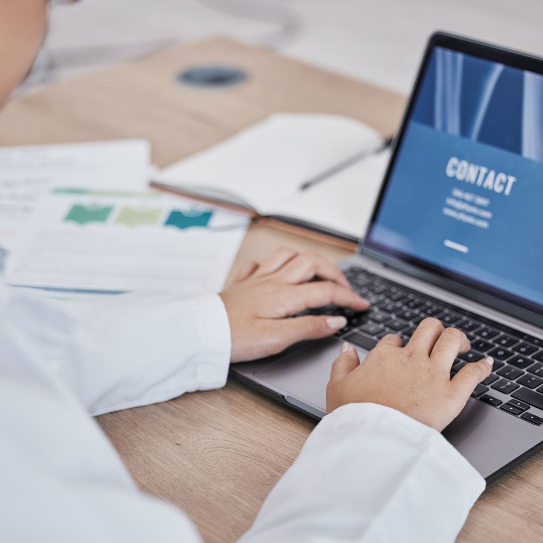 Image showing a professional reviewing coding and compliance documents